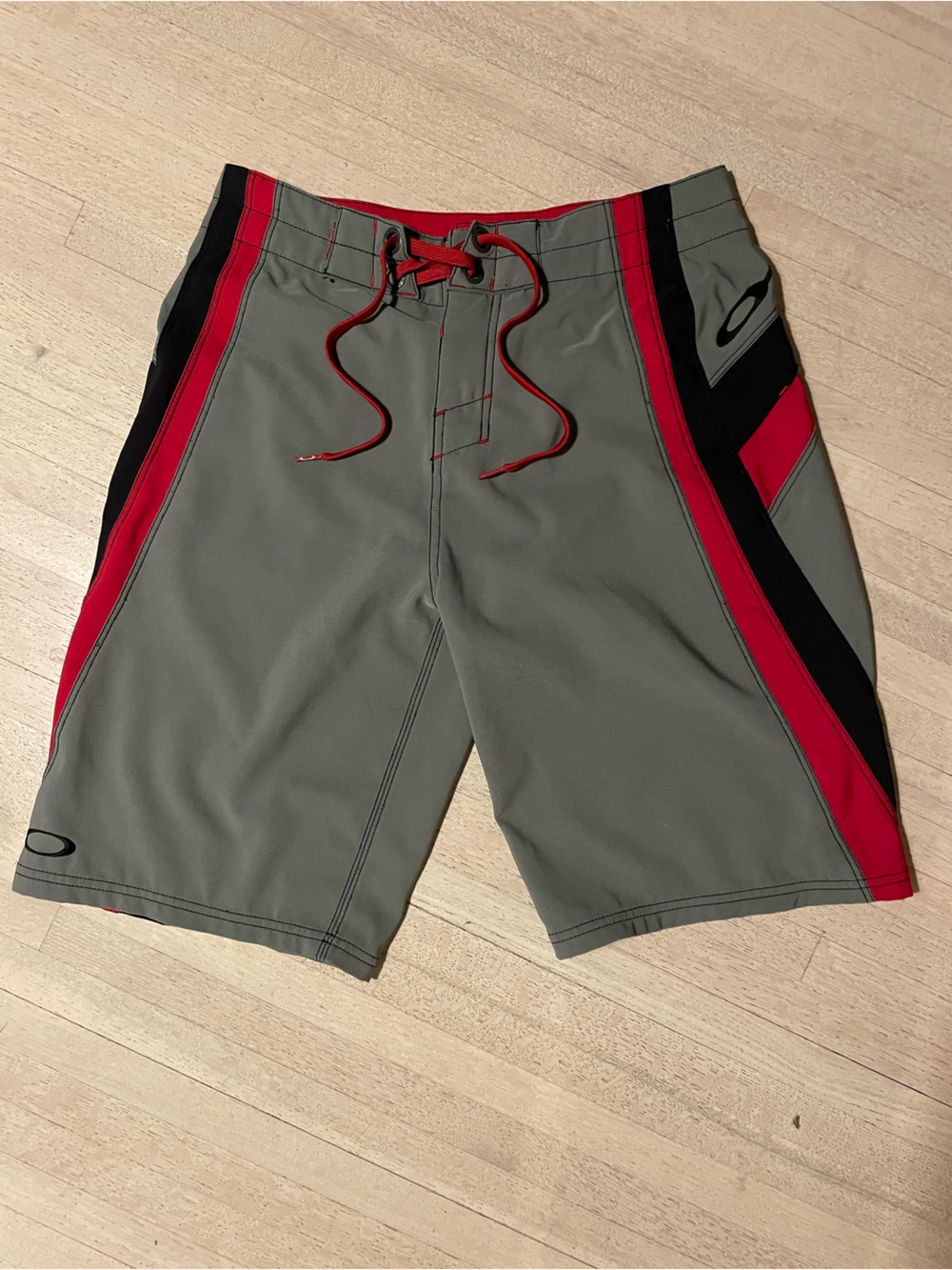 Oakley Men’s Gray Swim Board Shorts with Red and Black Panels